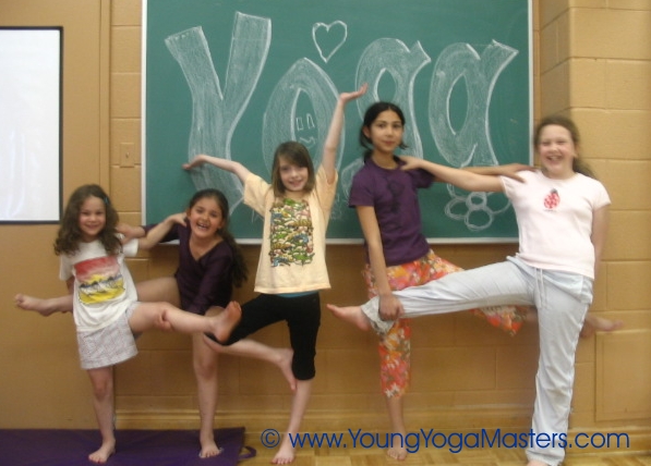 Create a Solid Plan to Bring Yoga to Your Community like these children doing yoga poses at a community centre