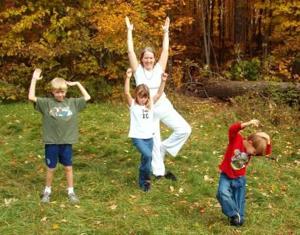 tree pose with kids yoga teacher trainer Aruna Kathy Humphrys