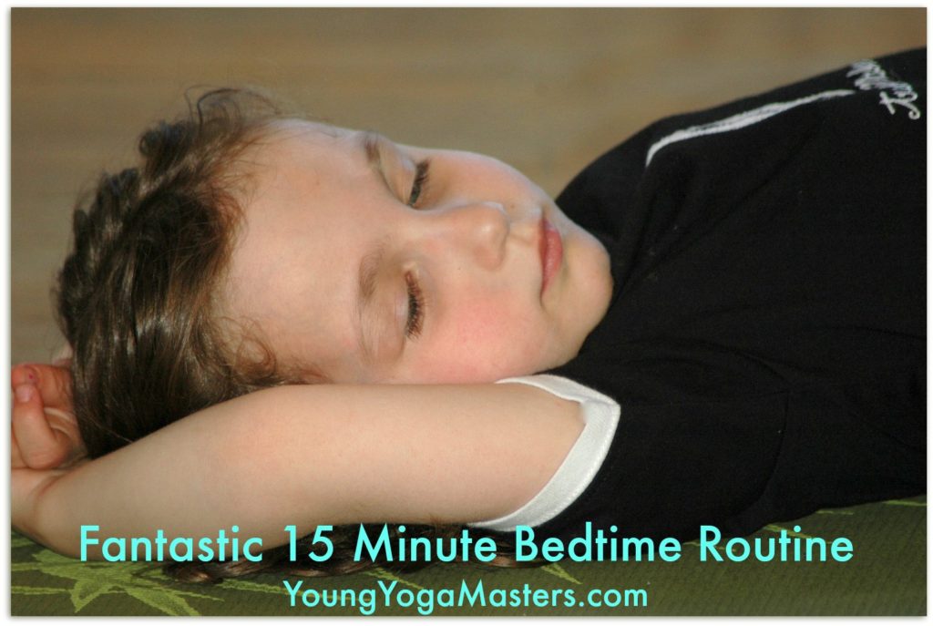 A chlld resting at the end of yoga class and yoga bedtime tips to help children relax and sleep. 