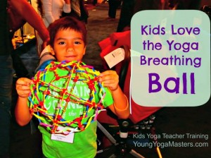 a boy holding a toy called a breathing ball, a ball that expands and contracts and helps kids understand deep breathing