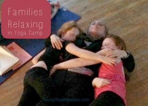 Mother and Daughters share a tender moment in Kids Yoga Camp.