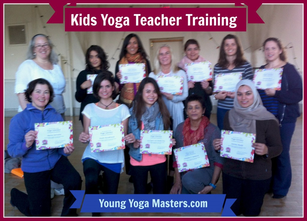 a group of kids yoga teachers holding their certificates