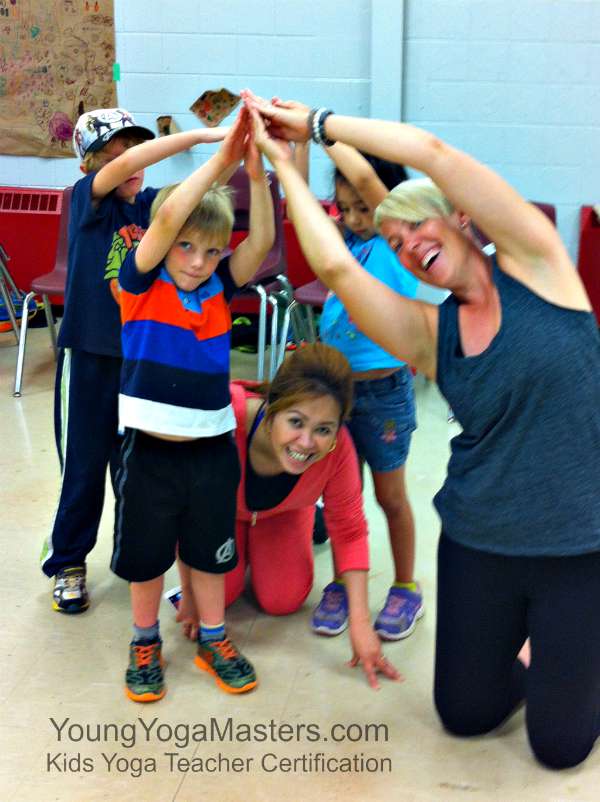 Group Crescent Moon Pose in Kids Yoga Teacher Certification Toronto