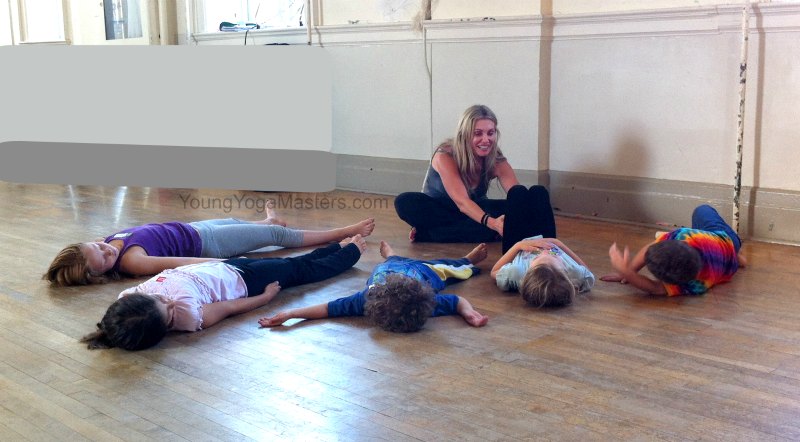 relaxation during kids yoga class and kids yoga teacher training