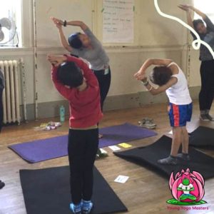 Children doing Moon Pose in a Kids Yoga Class